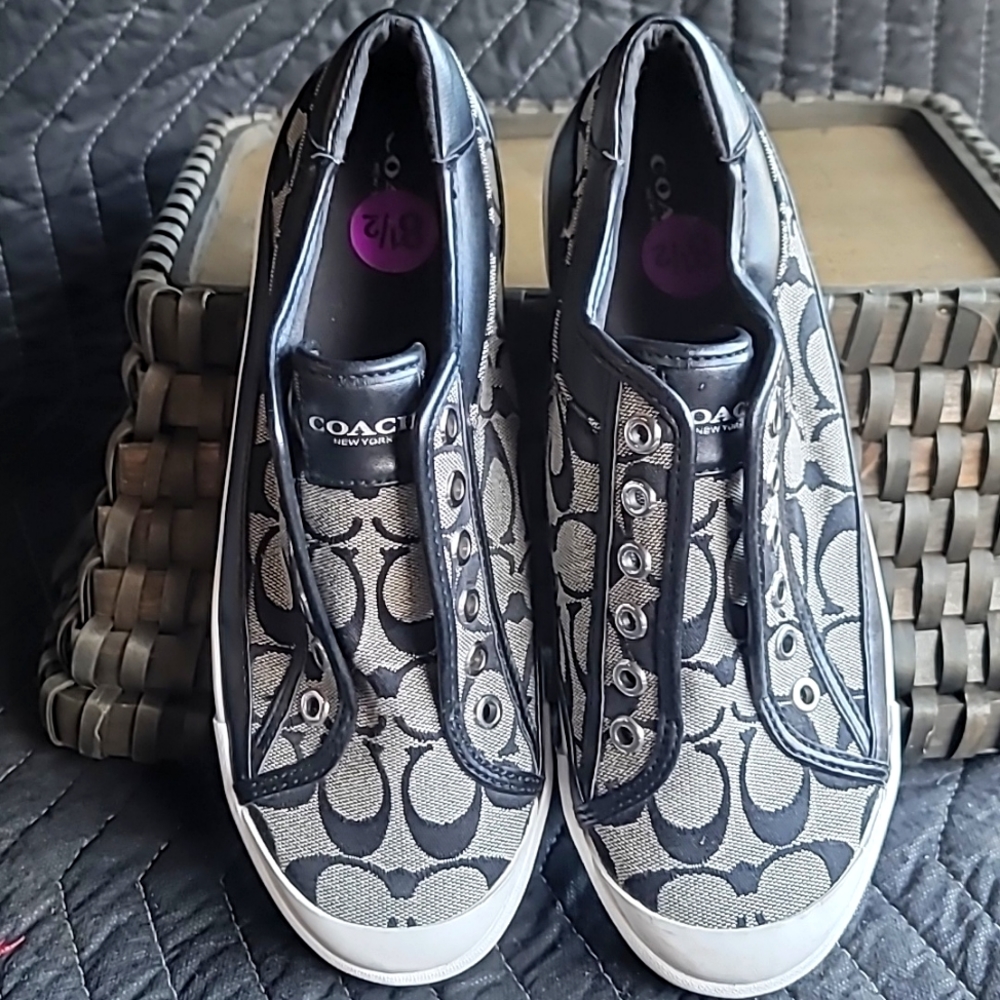 Slightly worn black coach sneakers